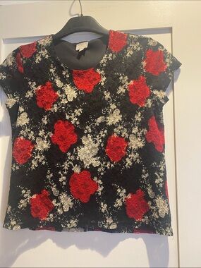 cleo Black Top with Roses on it.   Cap sleeves. Petite Lg